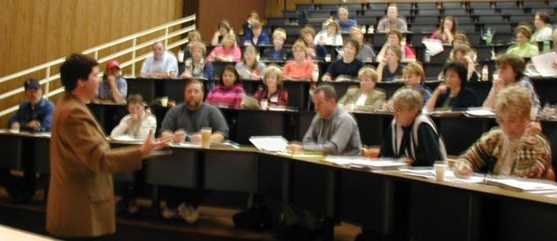 Becky speaking to an auditorium of entrepreneurs.