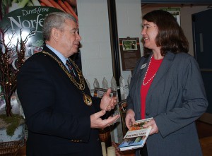 Mayor of Norfolk County Dennis Travale and Becky McCray, holding her book Small Town Rules