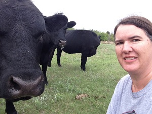 Becky McCray takes a selfie with some of her cows.