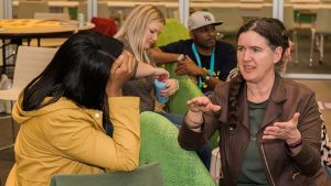 Becky McCray and a diverse group of audience members talking