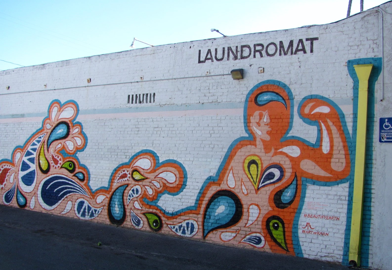 Fluid design mural says Laundromat