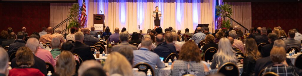 Rural speaker Becky McCray keynote at a national conference, a packed ballroom. Photo courtesy of NADO