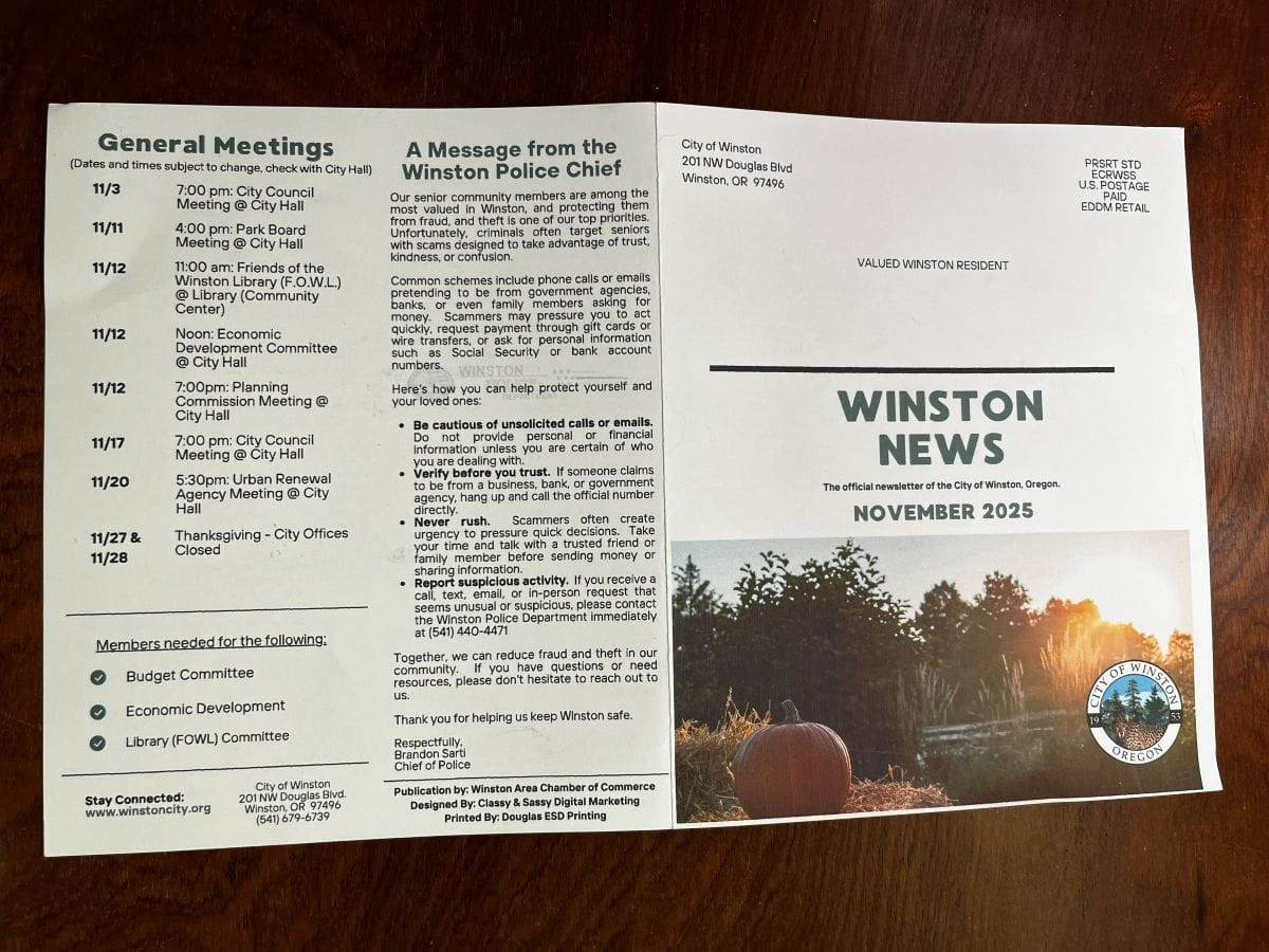 The City of Winston, Oregon paper newsletter laid flat showing the front cover with mailing details and news stories on the back.